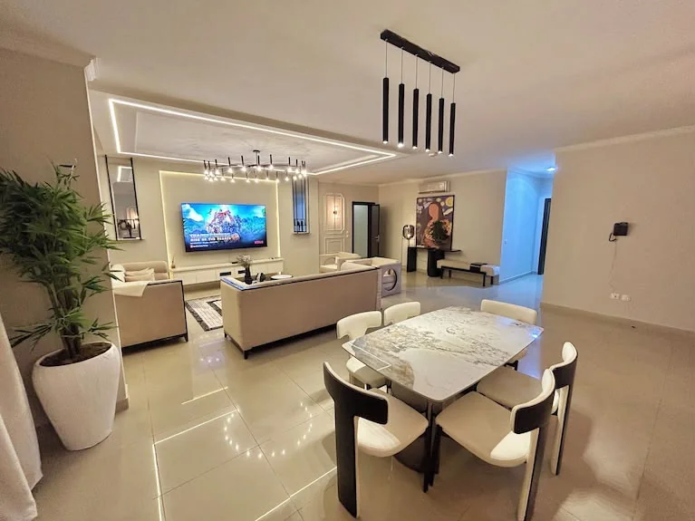 Dining room with a wooden table set for six